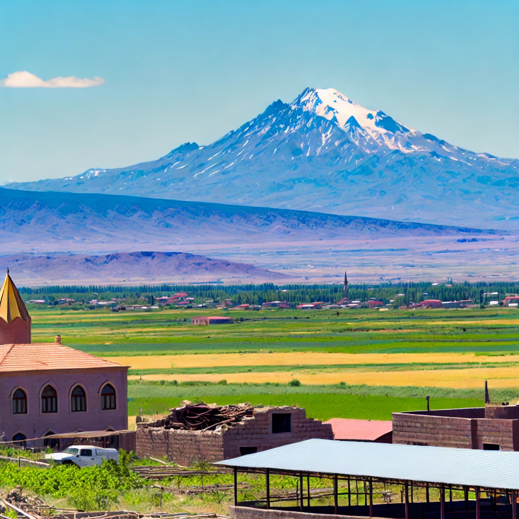 Scenic view of Iğdır, Turkey featuring Mount Ararat in the background, traditional architecture, and lush agricultural fields.