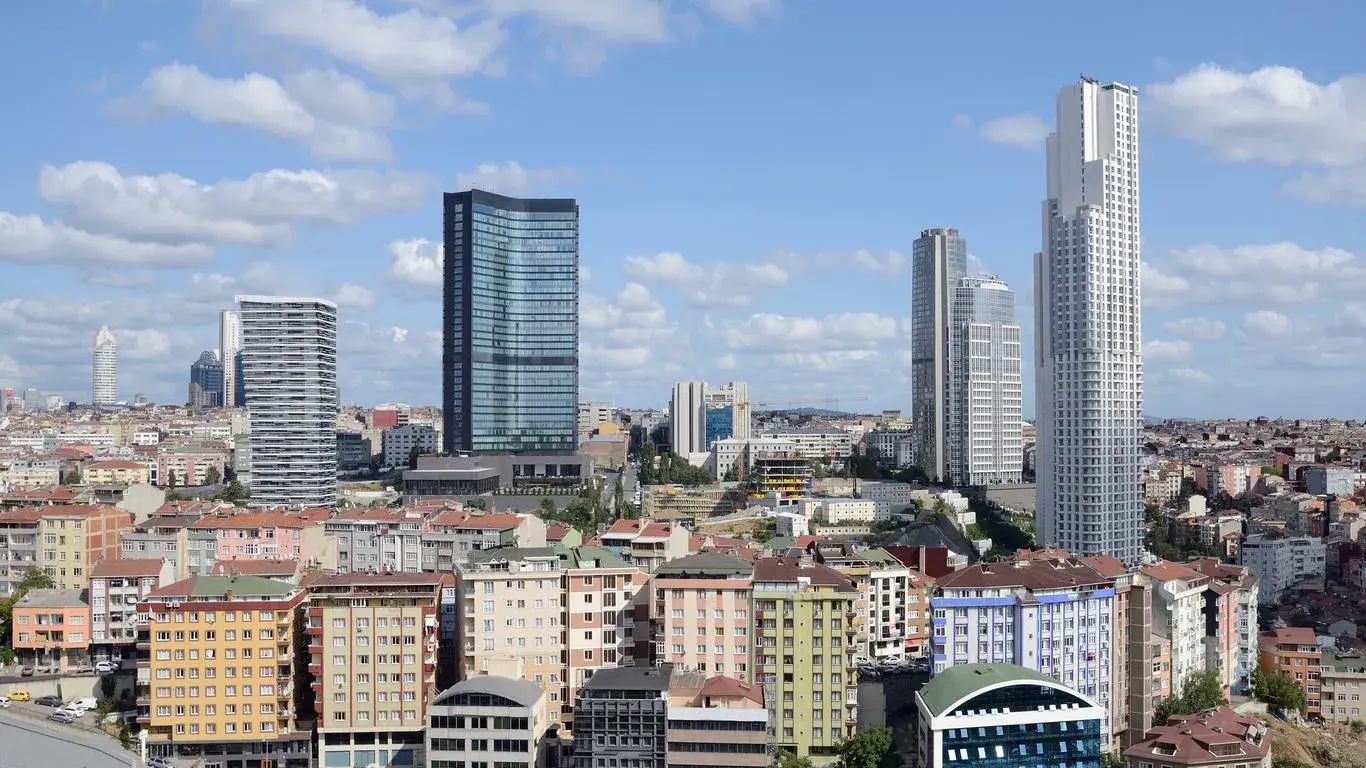 A bustling street scene in Şişli, Istanbul, Turkey, showcasing a mix of modern and historical buildings.