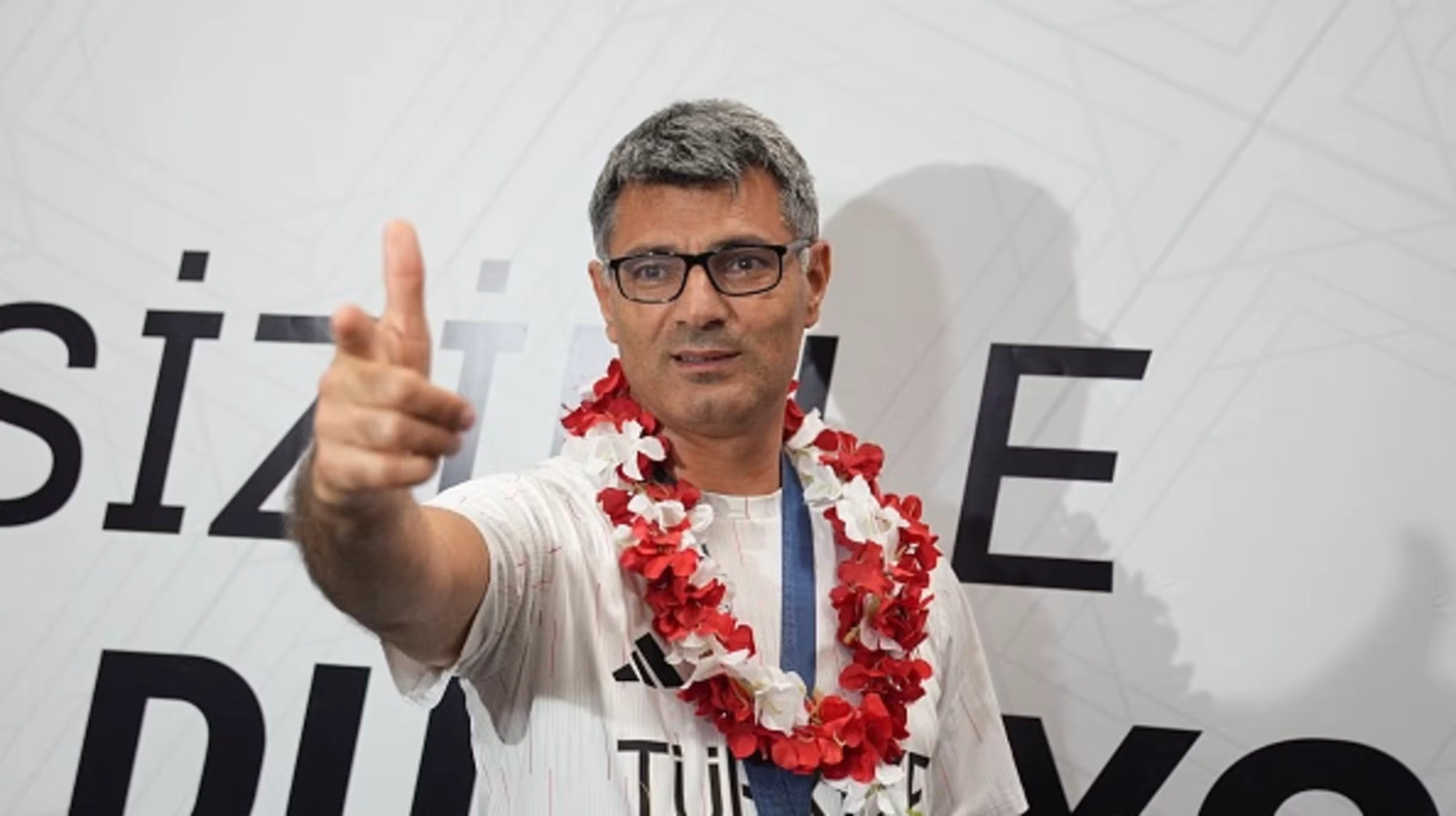 Yusuf Dikec, Türkiye's Olympic silver medalist in shooting, performing his iconic relaxed pose.